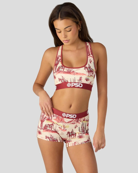 Cream and red ranch-print sports bra and shorts set with PSD branding and elastic waistbands.