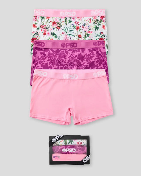 Three underwear pieces with pink waistbands: floral print, magenta floral pattern, and solid pink, shown folded and in packag