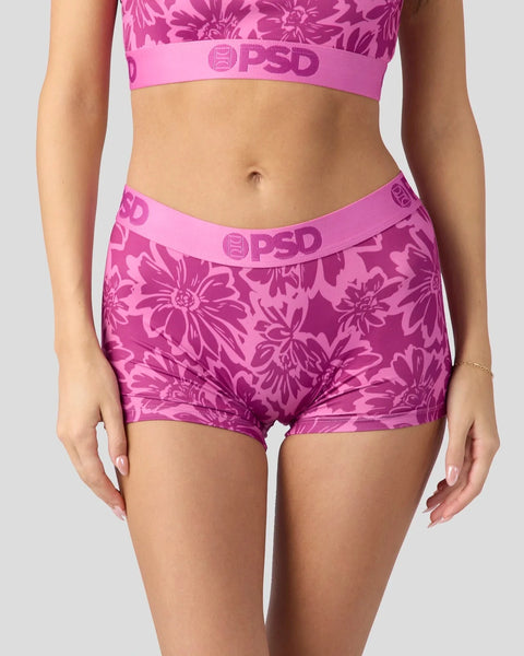 Pink floral printed sports bra and boy shorts set with branded waistband.