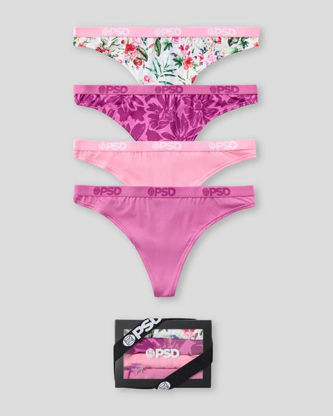 Four underwear briefs in floral and solid pink patterns with branded waistband, displayed with packaging box.
