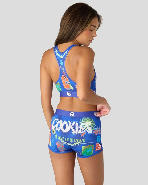 Woman wearing blue sports bra and shorts set with 