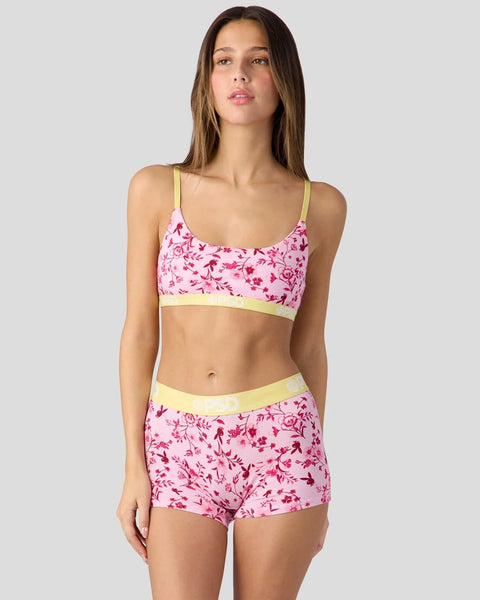 Pink floral bra and shorts set with yellow trim and thin spaghetti straps.