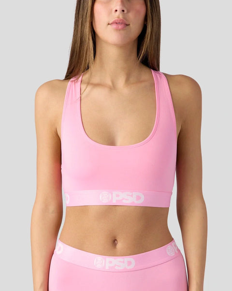 Pink sports bra with scoop neckline and branded elastic waistband.
