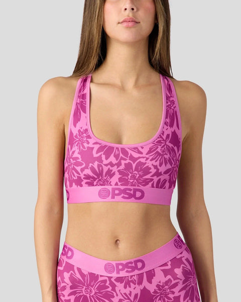 Pink floral print racerback sports bra with matching waistband featuring PSD branding.