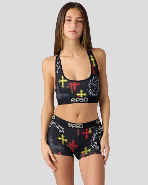 Black sports bra and shorts set with multicolored cross and circular emblem print, PSD branding.