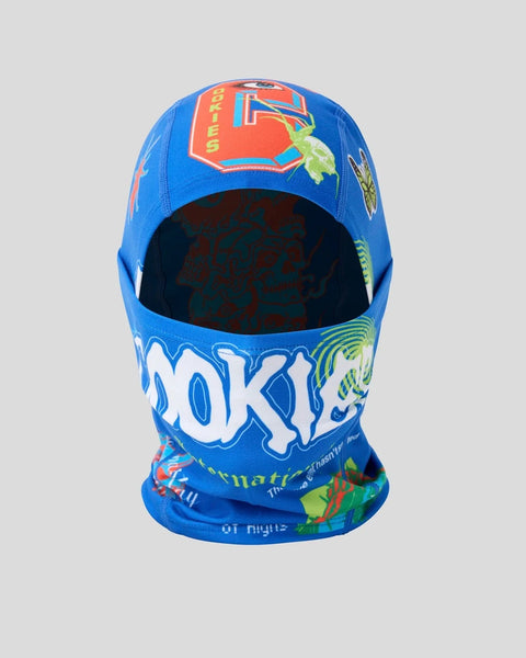 Blue balaclava-style hat with colorful graphic print and "COOKIES" text on front.
