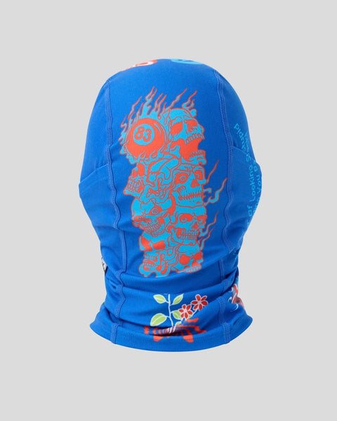 Blue balaclava with red skull and flame design, mesh panels on sides, and floral pattern at neck.