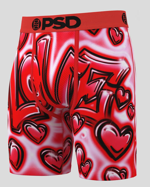 Red PSD boxer briefs with black-outlined heart and lightning bolt print pattern throughout.