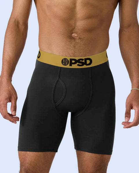 Black boxer briefs with gold waistband and PSD branding.
