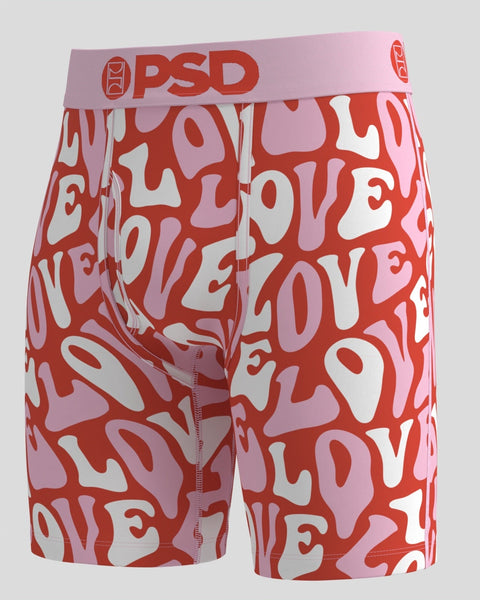 Red and pink modal shorts with abstract "LOVE" text pattern and red PSD waistband.