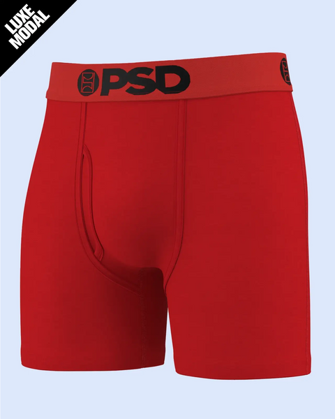 Red boxer shorts with black PSD waistband logo and contrast stitching details.