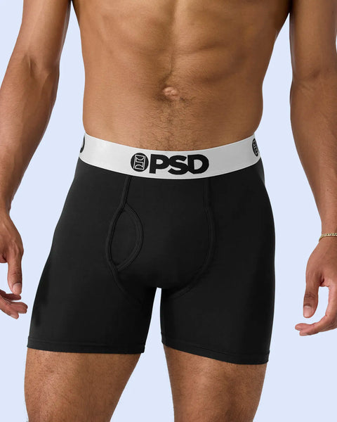 Man wearing black boxer briefs with white and silver PSD waistband.