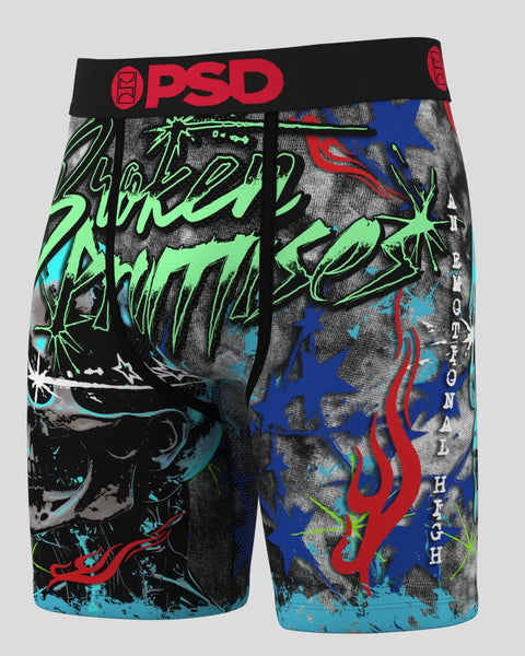 Black and gray shorts with neon green graffiti text, blue stars, red curved lines, and cyan accents; red OPsd logo on black w