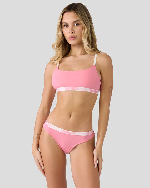 Baby pink ribbed two-piece swimsuit with white trim and branded waistband on model.