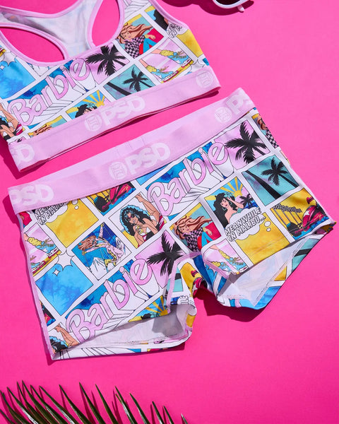 Barbie Malibu-themed underwear set with colorful comic-style prints, palm trees, and "Barbie" text on pink and white fabrics.