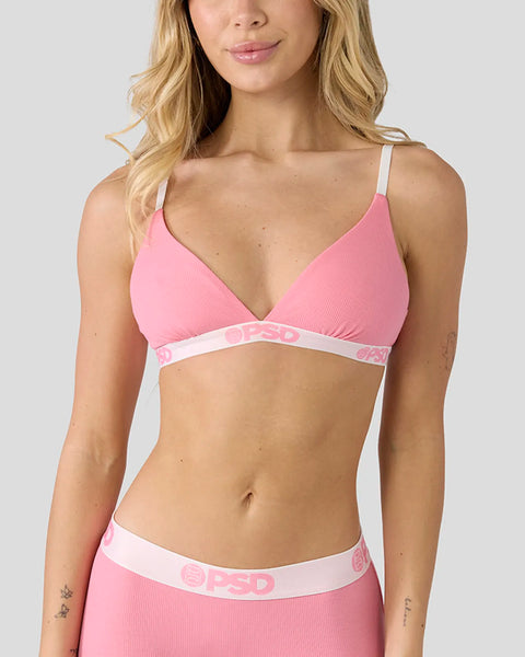 Baby pink ribbed bra with spaghetti straps and white logo waistband.