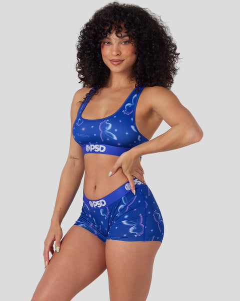 Blue sports bra and shorts set with Playboy bunny logo and PSD waistband detail.
