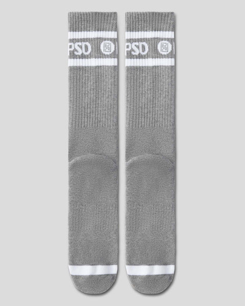 Gray crew socks with white stripes and PSD logo at the calf.