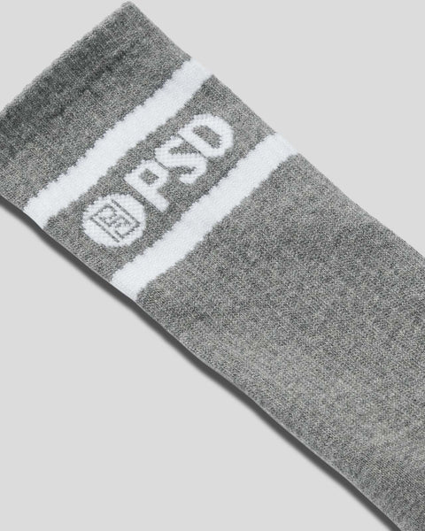 Gray crew socks with white stripe band and logo detail.