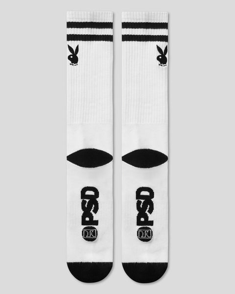 Pair of white crew socks with black Playboy bunny logo, horizontal stripes, and eye design.