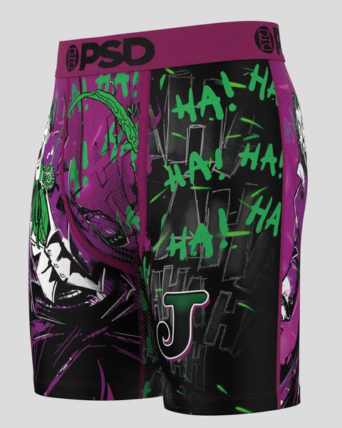 Purple and black PSD boxers with Joker character artwork and green "haha" text throughout.