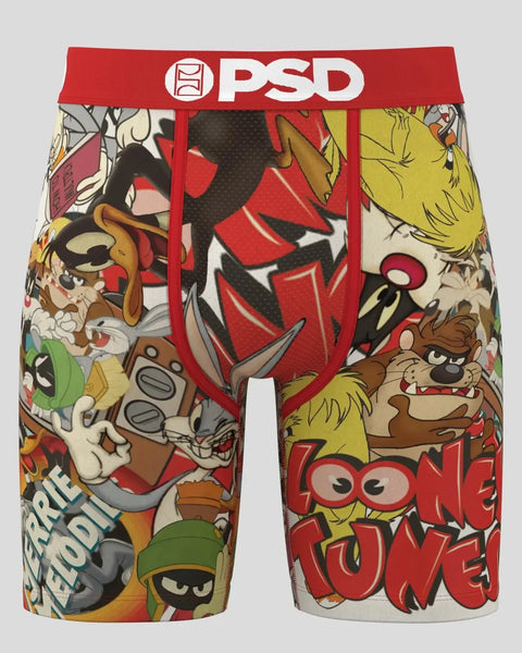 PSD brand boxer shorts with red waistband featuring colorful Looney Tunes characters and comic-style graphics.