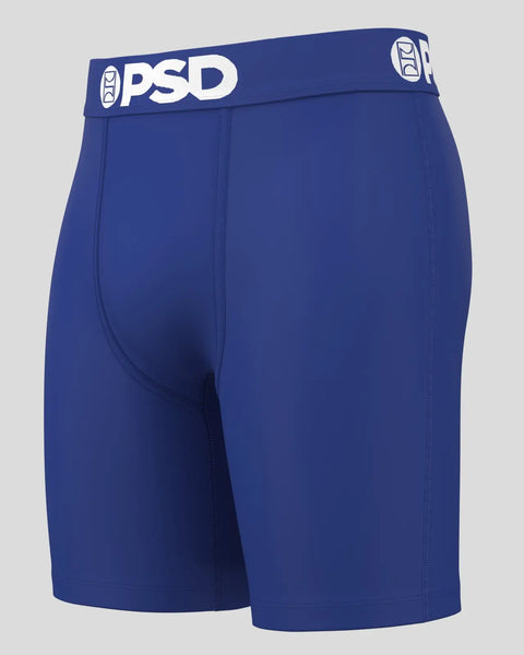 Royal blue PSD boxer briefs with white waistband logo and center seam detail.