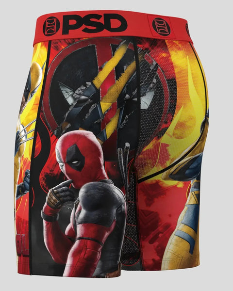 PSD men's boxer briefs with red waistband featuring Deadpool and Wolverine characters and yellow flame graphics.