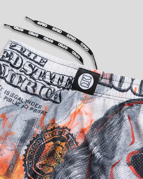 White active short with black and orange graphic print, paired with black branded drawstrings and waistband patch.