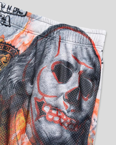 Athletic short with graphic skull design in black, white, and orange on textured fabric.