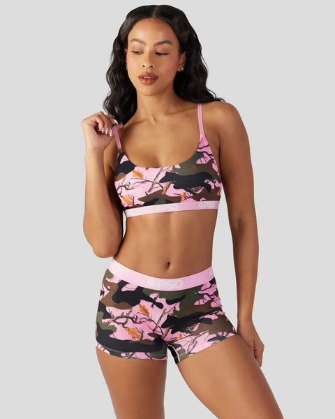 Pink and black camouflage sports bra and matching shorts with adjustable straps and elastic waistband.