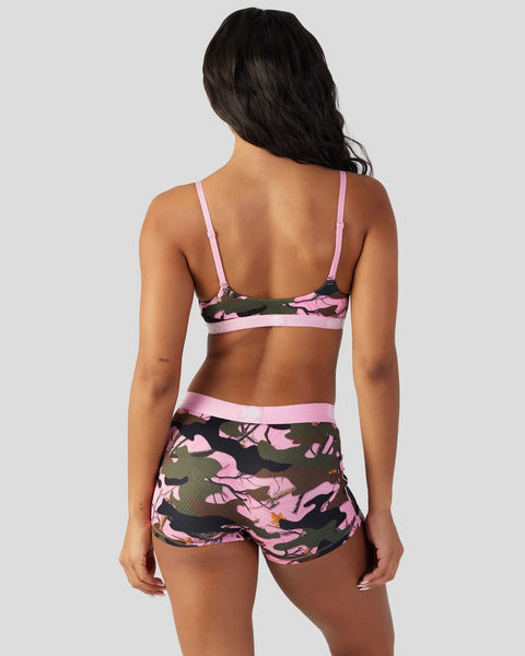 Women's two-piece swimsuit with pink, black, and green camouflage pattern and adjustable straps, shown from back view.