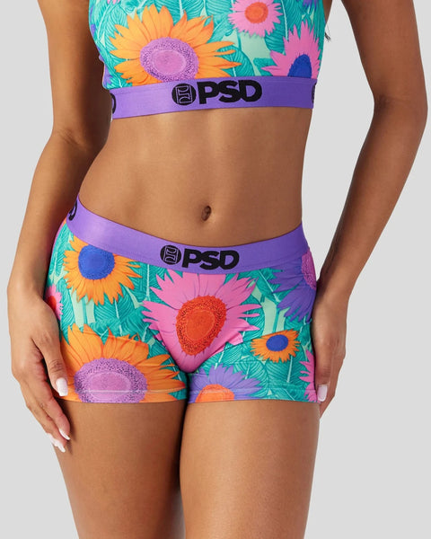 Two-piece PSD underwear set with colorful sunflower and floral print on turquoise, purple, pink, and yellow background.