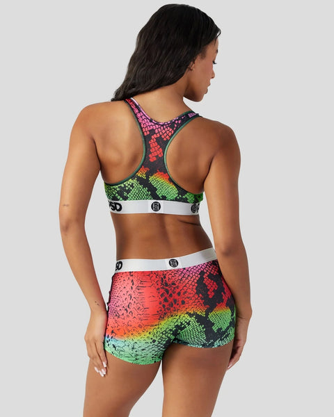 Women's sports bra and shorts set with multicolor snake scale pattern in neon pink, green, and yellow.