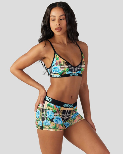 Two-piece lingerie set with tartan and blue floral print, black straps and branded waistband.
