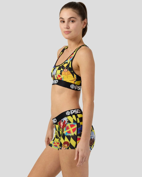 Woman wearing X-Men checkers patterned sports bra and shorts with black elastic bands.