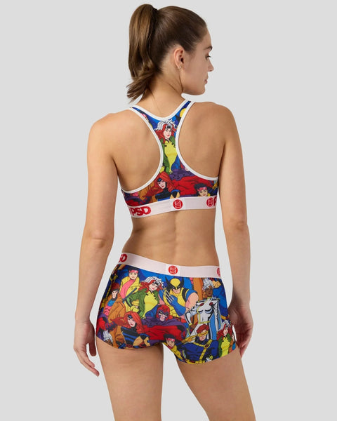 Woman wearing X-Men character print sports bra and matching shorts with blue, red, and yellow colorway.