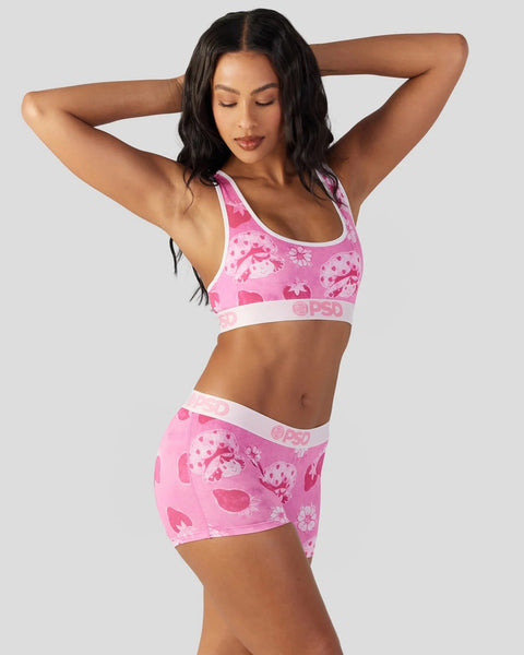 Pink velour two-piece set with strawberry and floral print, featuring a racerback sports bra and matching shorts with white t