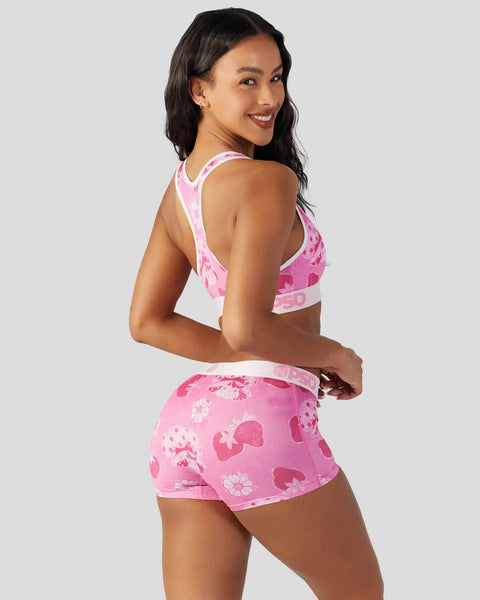 Pink velour sports bra and shorts set with strawberry and floral print pattern.