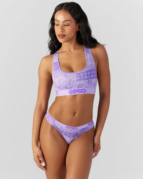 Purple bandana-print sports bra and briefs set with geometric pattern and branded elastic band.