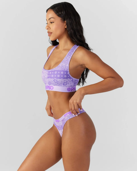Purple bandana-print sports bra and matching thong underwear set with geometric pattern and brand waistband.