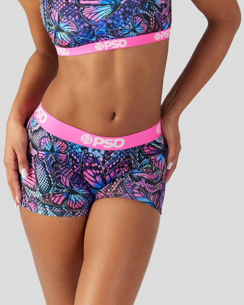 Butterfly and snake scale print sports bra and boy shorts with pink PSD waistbands.