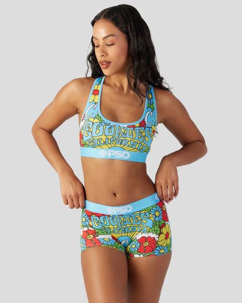 Blue sports bra and matching shorts with colorful floral and text print design.