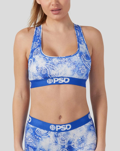 Blue and white bandana-patterned racerback sports bra with PSD waistband.