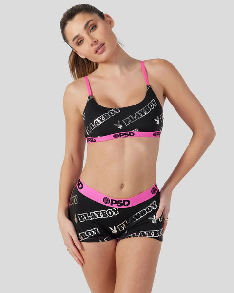 Black bra and shorts set with neon pink straps and waistband featuring Playboy branding and PSD logo.
