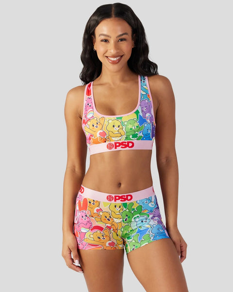 Colorful Care Bears sports bra and shorts set with rainbow gradient design and PSD branding.
