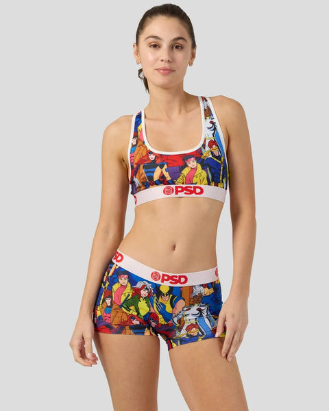Woman wearing X-Men character print sports bra and shorts with PSD waistbands in blue, red, and yellow.