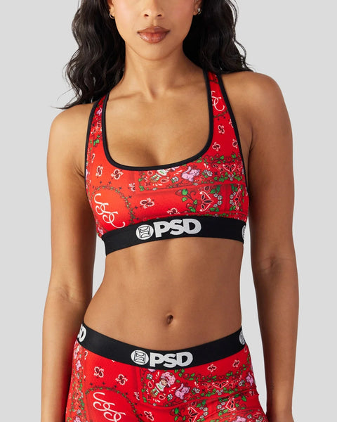 Red sports bra with strawberry and floral print, black elastic band with PSD logo.
