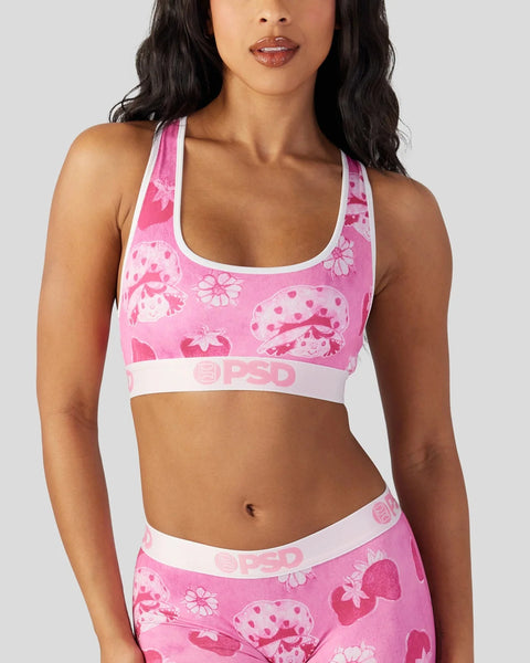 Pink velour sports bra with strawberry and floral print, white trim, and PSD branding.
