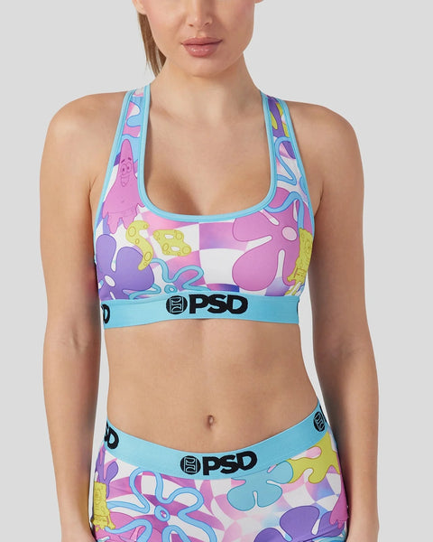 Women's sports bra with neon multicolor cartoon character print and turquoise trim with PSD branding.
